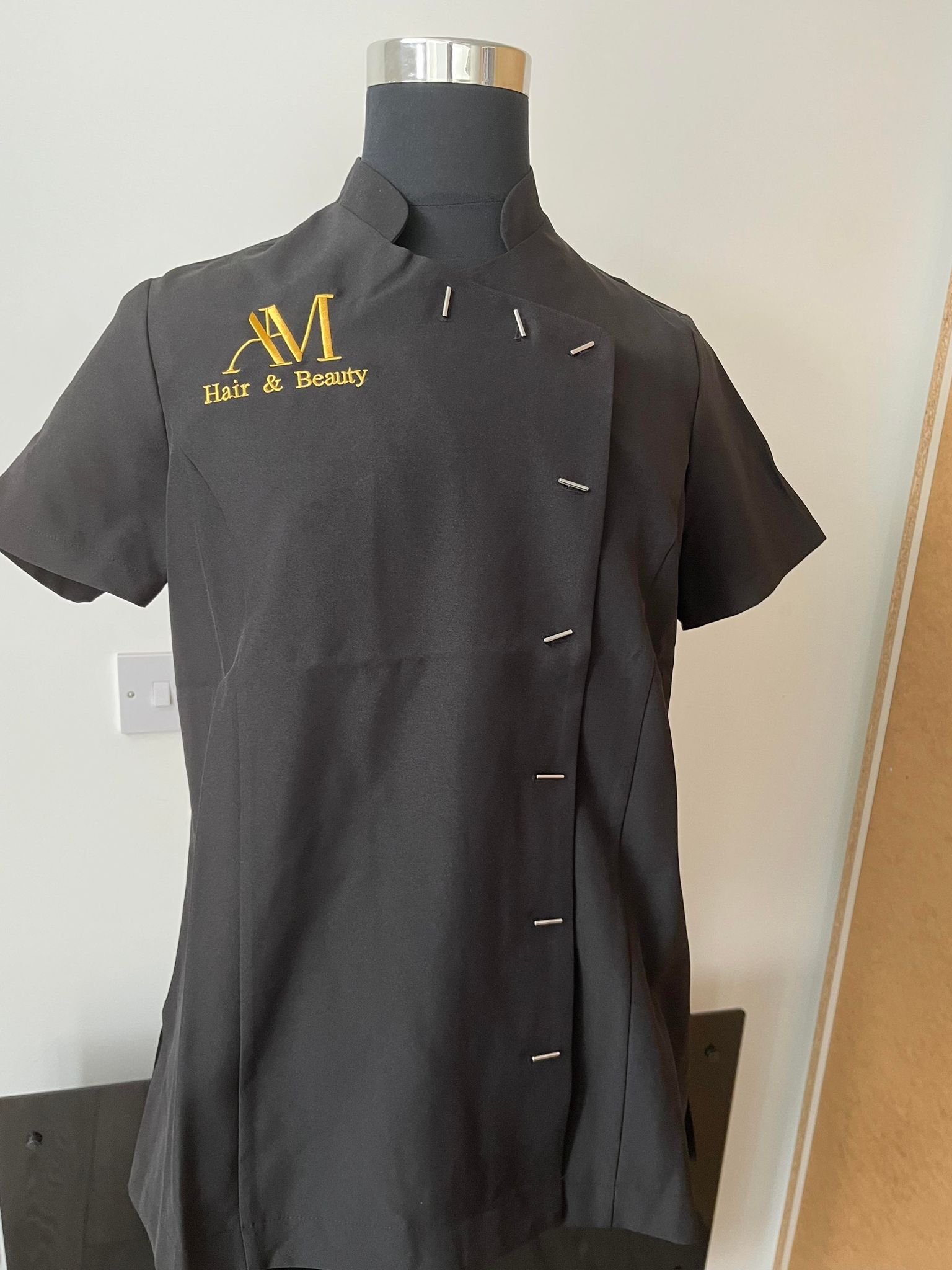 Professionally embroidered AM Hair & Beauty uniform by FitPrint Studio